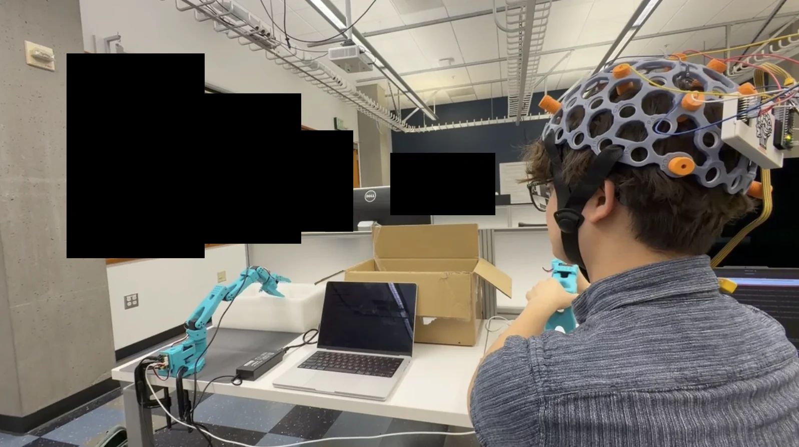 me controlling a robotic arm